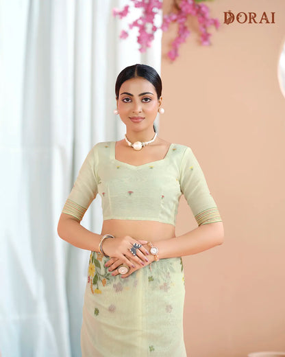 Creamy Radiance – Chikoo Muga Cotton Saree with Floral Artistry