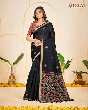 Midnight Weaver – Black Muga Cotton Saree with Patola Pallu Tribal Patterns