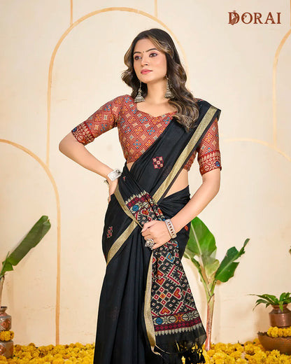 Midnight Weaver – Black Muga Cotton Saree with Patola Pallu Tribal Patterns