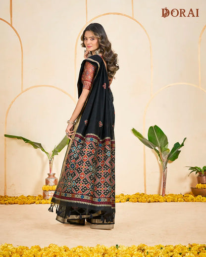 Midnight Weaver – Black Muga Cotton Saree with Patola Pallu Tribal Patterns